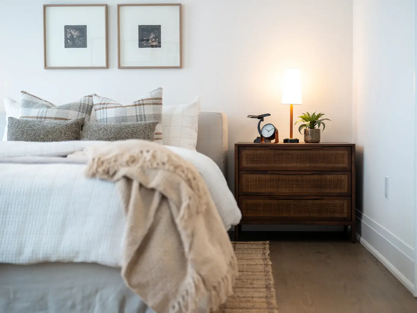 Apartment bedroom with soft neutral bedding — PLACEHOLDER image